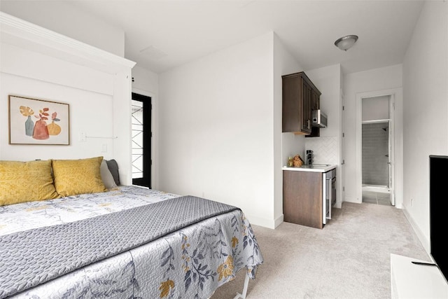bedroom with baseboards and light carpet