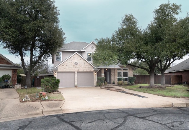 view of front of home with a front lawn and a garage