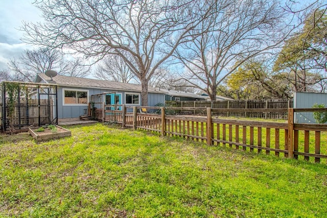 view of yard featuring a fenced backyard