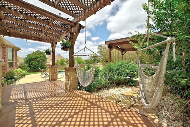 view of patio featuring fence, a pergola, and a fenced in pool