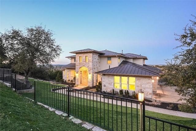 205 Palazza Alto Dr, Austin, TX 78734 - view of front facade with a standing seam roof, stone siding, metal roof, and stucco siding