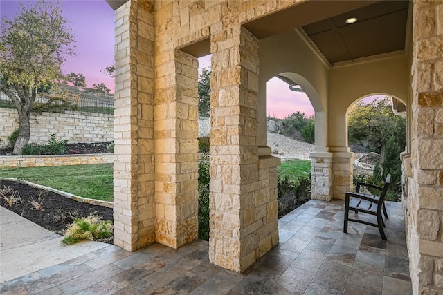 205 Palazza Alto Dr, Austin, TX 78734 - patio terrace at dusk with covered porch