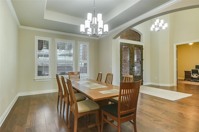 205 Palazza Alto Dr, Austin, TX 78734 - dining area with a chandelier, french doors, a raised ceiling, arched walkways, and ornamental molding