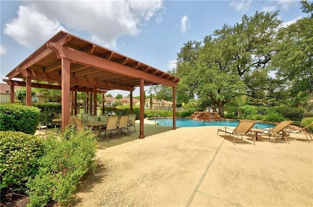 exterior space with a pool, a patio, and a pergola