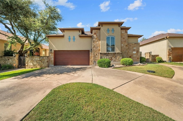 mediterranean / spanish house featuring a gate, stone siding, stucco siding, a garage, and concrete driveway