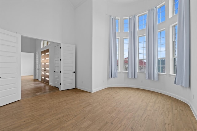 2324 Bel Paese Bnd, Leander, TX 78641 - unfurnished room with a high ceiling and wood finished floors