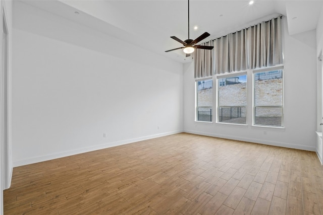 2324 Bel Paese Bnd, Leander, TX 78641 - unfurnished room featuring a towering ceiling, wood finished floors, a ceiling fan, and recessed lighting
