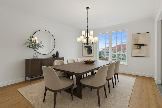 2324 Bel Paese Bnd, Leander, TX 78641 - dining area with crown molding, a chandelier, and light wood finished floors