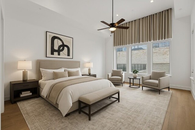 2324 Bel Paese Bnd, Leander, TX 78641 - bedroom featuring light wood-style floors, a towering ceiling, recessed lighting, and a ceiling fan