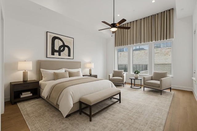 2324 Bel Paese Bnd, Leander, TX 78641 - bedroom with wood finished floors, a towering ceiling, recessed lighting, and ceiling fan