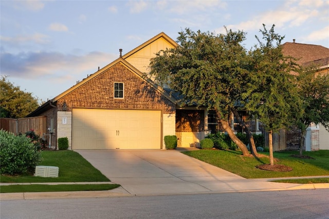 4131 Van Ness Ave, Round Rock, TX 78681 - view of front of home featuring an attached garage, driveway, and brick siding