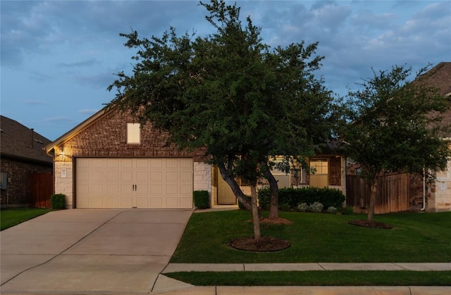 4131 Van Ness Ave, Round Rock, TX 78681 - obstructed view of property featuring driveway, an attached garage, and brick siding