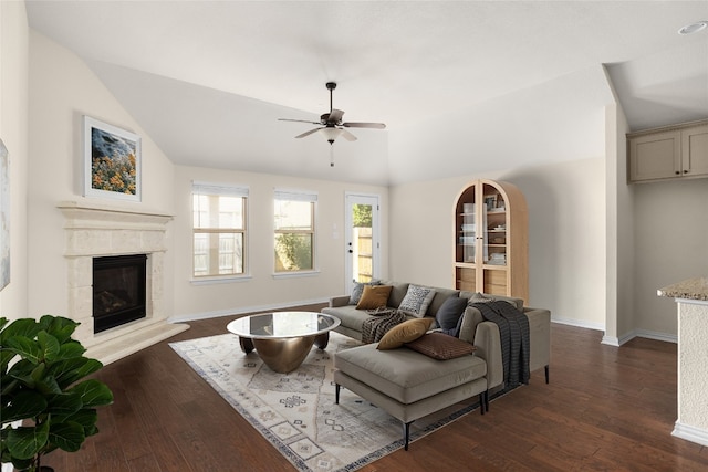 4131 Van Ness Ave, Round Rock, TX 78681 - living area featuring ceiling fan, dark wood-style flooring, lofted ceiling, a fireplace, and baseboards