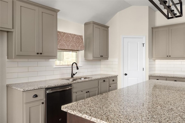 4131 Van Ness Ave, Round Rock, TX 78681 - kitchen featuring dishwasher, gray cabinets, a sink, light stone counters, and lofted ceiling