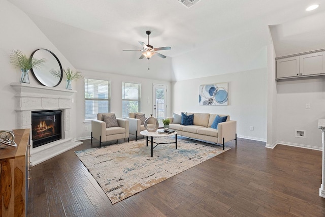 4131 Van Ness Ave, Round Rock, TX 78681 - living area featuring a ceiling fan, vaulted ceiling, dark wood-style floors, and a glass covered fireplace