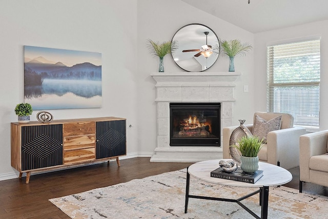 4131 Van Ness Ave, Round Rock, TX 78681 - living room with wood finished floors, a tile fireplace, a ceiling fan, and vaulted ceiling