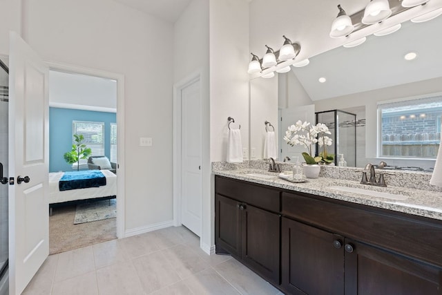 4131 Van Ness Ave, Round Rock, TX 78681 - ensuite bathroom with double vanity, a stall shower, lofted ceiling, tile patterned floors, and recessed lighting