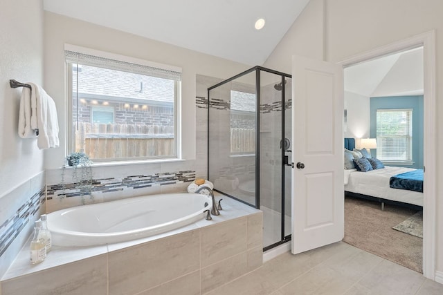4131 Van Ness Ave, Round Rock, TX 78681 - bathroom with a bath, a stall shower, lofted ceiling, ensuite bath, and tile patterned floors