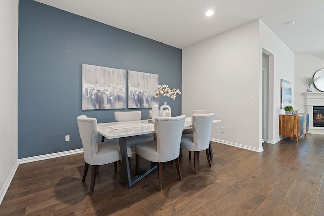 4131 Van Ness Ave, Round Rock, TX 78681 - dining space with wood finished floors, recessed lighting, and a glass covered fireplace