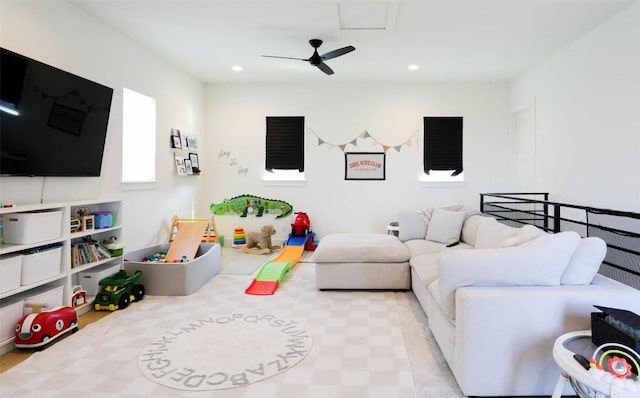 living area featuring ceiling fan and recessed lighting