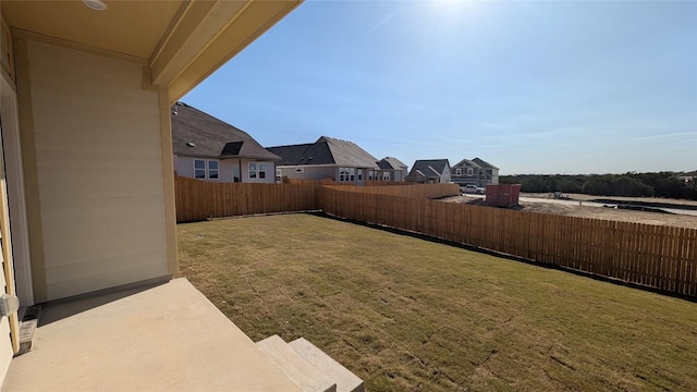 view of yard featuring a patio and a fenced backyard