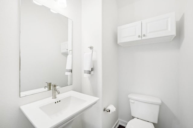 bathroom featuring a sink and toilet