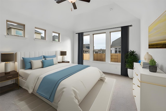 bedroom featuring lofted ceiling, ceiling fan, and light colored carpet