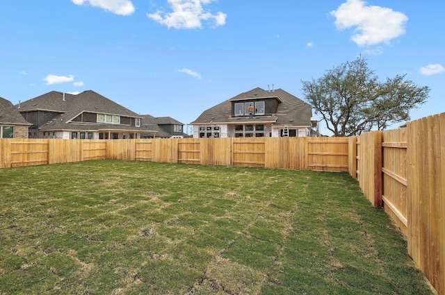 view of yard with a fenced backyard