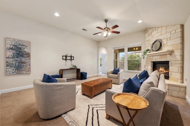 3541 Guadalajara St, Round Rock, TX 78665 - living room featuring light colored carpet, a ceiling fan, recessed lighting, and a stone fireplace