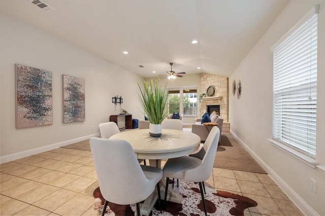 3541 Guadalajara St, Round Rock, TX 78665 - dining area featuring light tile patterned flooring, a ceiling fan, a fireplace, lofted ceiling, and recessed lighting