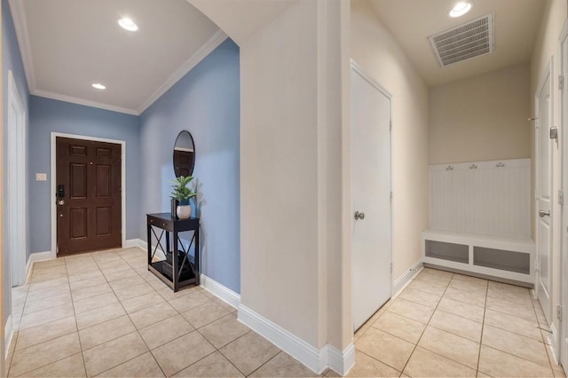 3541 Guadalajara St, Round Rock, TX 78665 - entryway with light tile patterned floors, crown molding, recessed lighting, and arched walkways