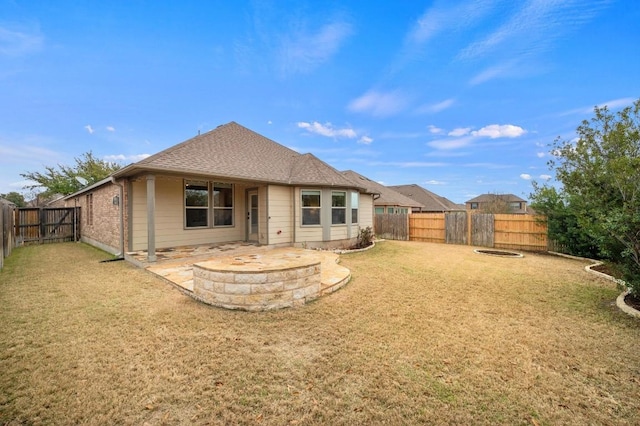 3541 Guadalajara St, Round Rock, TX 78665 - rear view of property featuring an outdoor fire pit, a fenced backyard, and roof with shingles