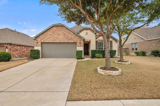 view of front of home featuring stone siding, concrete driveway, a front lawn, and an attached garage