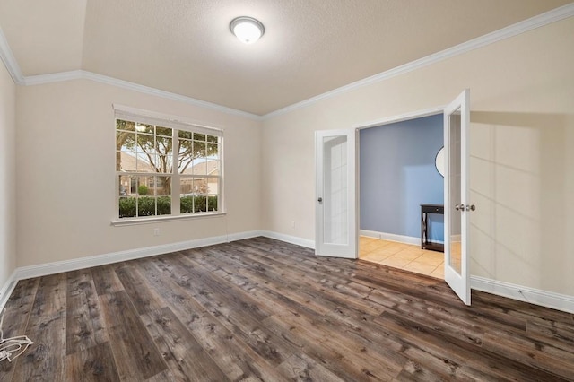 3541 Guadalajara St, Round Rock, TX 78665 - spare room with wood finished floors, ornamental molding, and french doors
