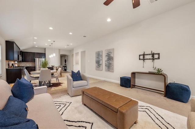 3541 Guadalajara St, Round Rock, TX 78665 - living room with arched walkways, light colored carpet, lofted ceiling, a ceiling fan, and recessed lighting