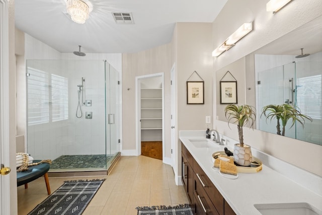 8112 Cobblestone, Austin, TX 78735 - full bath with a shower stall, double vanity, and tile patterned floors