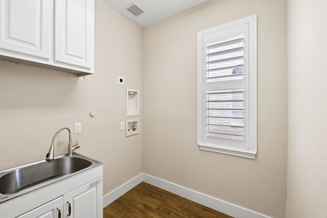 8112 Cobblestone, Austin, TX 78735 - washroom featuring cabinet space, electric dryer hookup, baseboards, washer hookup, and dark wood-style floors