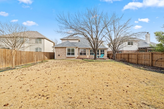 8112 Cobblestone, Austin, TX 78735 - back of house featuring brick siding and a fenced backyard