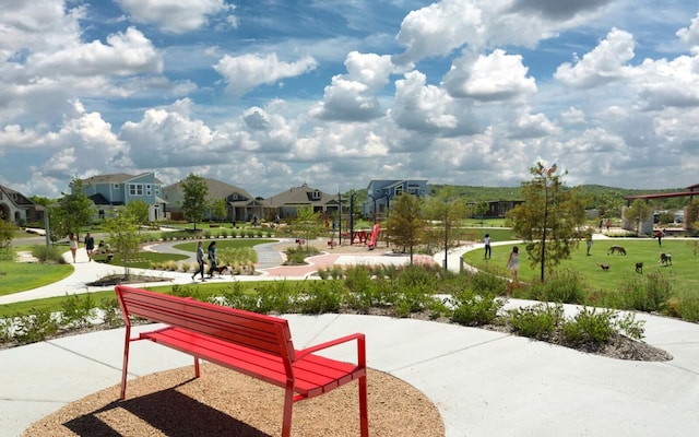 view of community featuring a residential view and a lawn