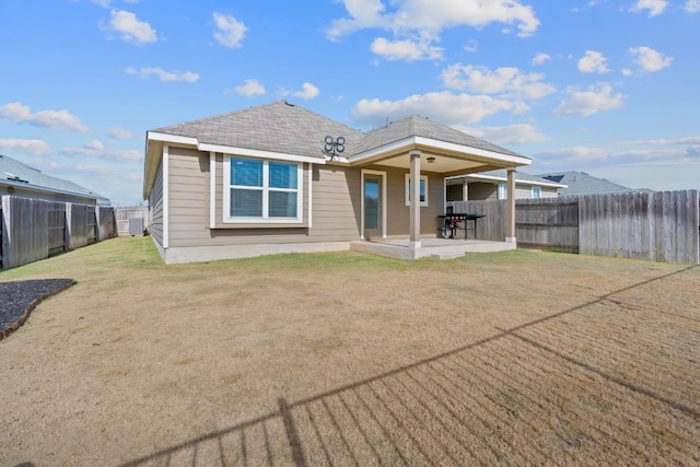 rear view of property featuring a patio area, a fenced backyard, and central AC