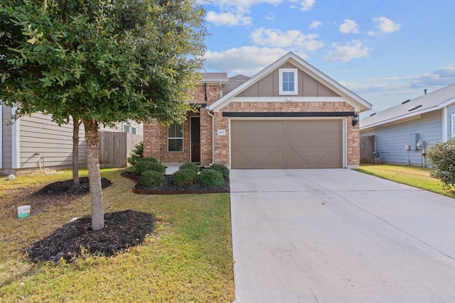 view of front facade featuring a garage, a front yard, concrete driveway, and brick siding