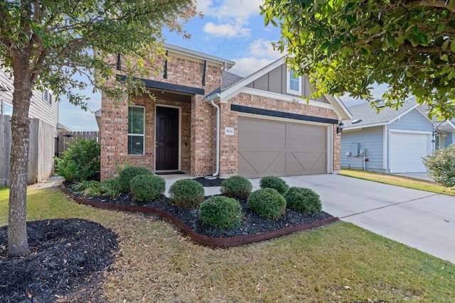 view of front of property featuring driveway, a garage, fence, and brick siding