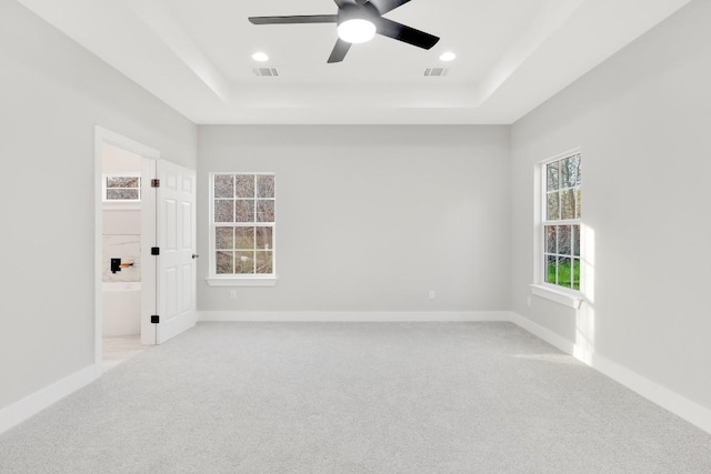 137 Puu Waa Waa Ln, Bastrop, TX 78602 - spare room featuring a raised ceiling, light carpet, a ceiling fan, and recessed lighting