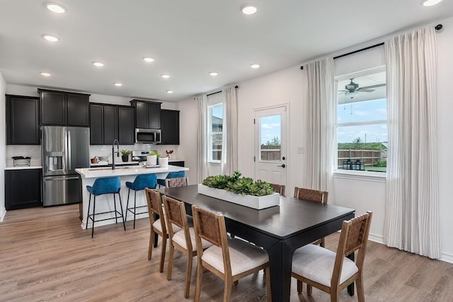 dining space with recessed lighting, ceiling fan, and light wood finished floors