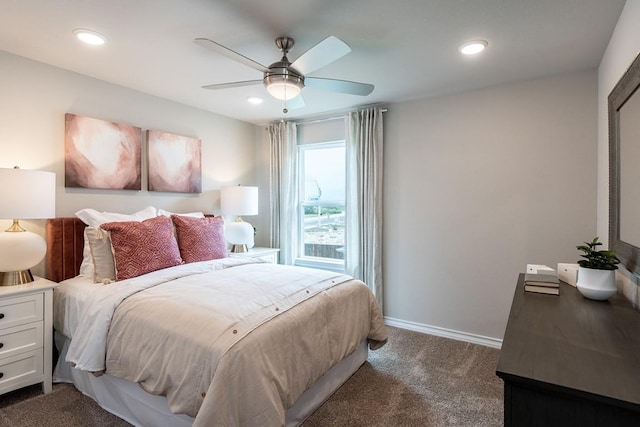 bedroom with dark colored carpet, recessed lighting, a ceiling fan, and baseboards