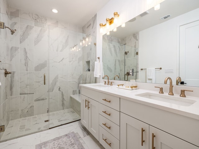 full bath featuring marble finish floor, visible vents, a sink, and a marble finish shower