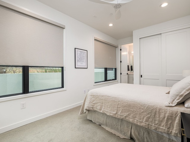 bedroom with recessed lighting, carpet floors, a ceiling fan, baseboards, and a closet