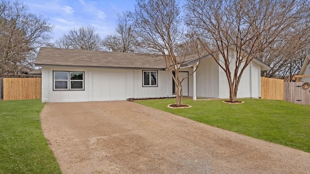 1112 Village Green Dr, Austin, TX 78753 - view of front of property featuring driveway and roof with shingles