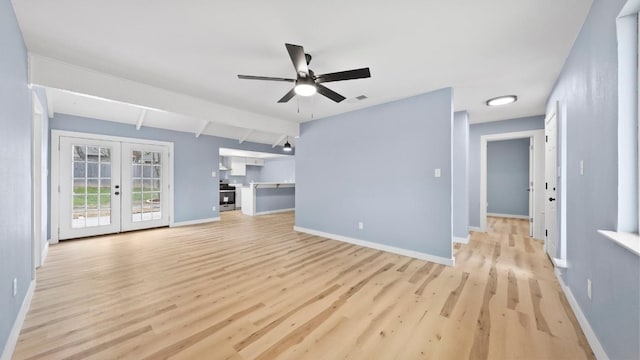 1112 Village Green Dr, Austin, TX 78753 - unfurnished living room with light wood-style flooring, french doors, a ceiling fan, baseboards, and beamed ceiling