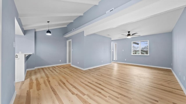 1112 Village Green Dr, Austin, TX 78753 - unfurnished living room with beam ceiling, light wood-style flooring, ceiling fan, and baseboards